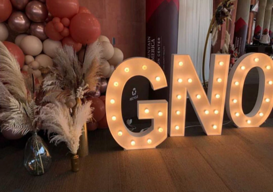 SexyModest lighted GNO sign with flowers and balloon arch