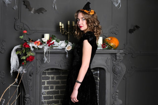 Woman wearing black dress for Halloween party