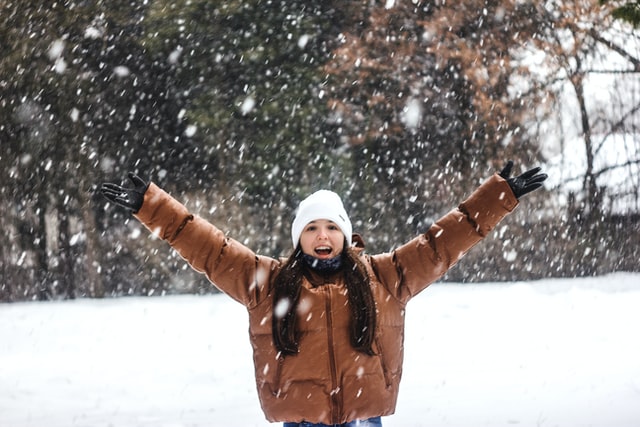 Woman standing in the snow