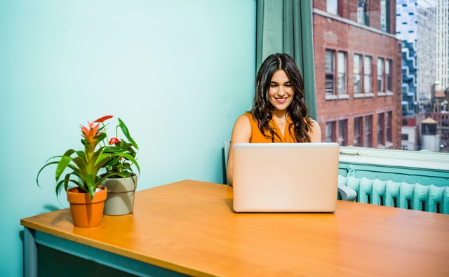 Woman working on laptop at desk